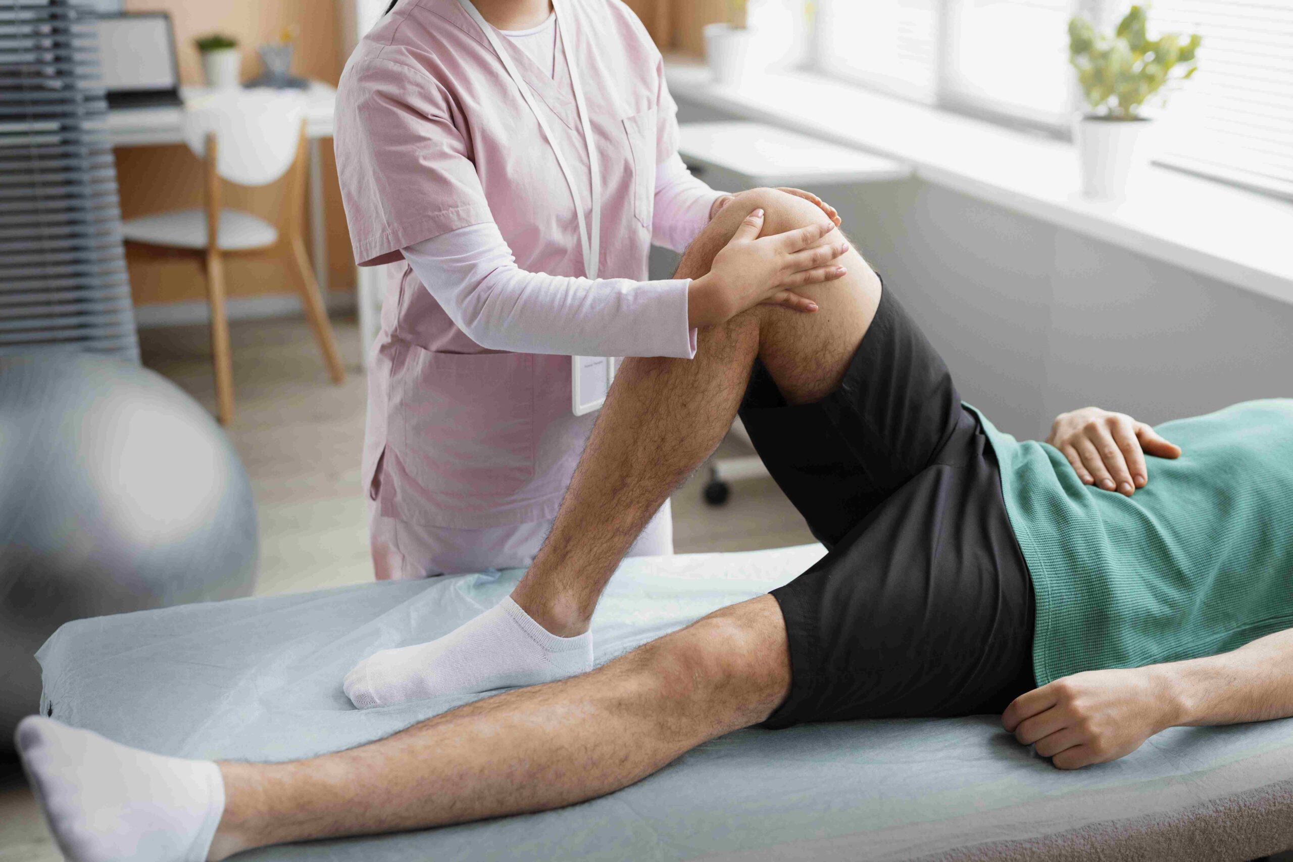 A Physiotherapist helping a patient during rehabilitation